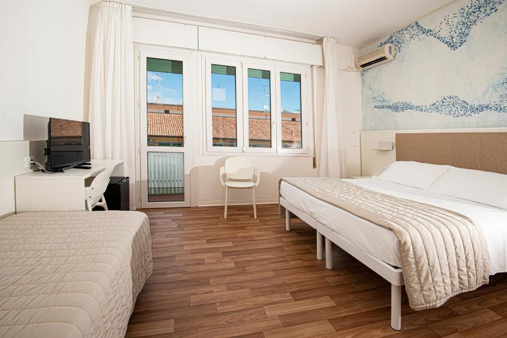 Postel nebo postele na pokoji v ubytování Hotel Splendid