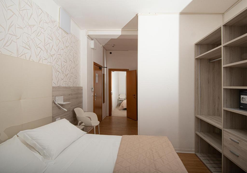 Postel nebo postele na pokoji v ubytování Hotel Splendid