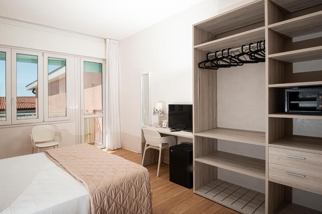 Postel nebo postele na pokoji v ubytování Hotel Splendid