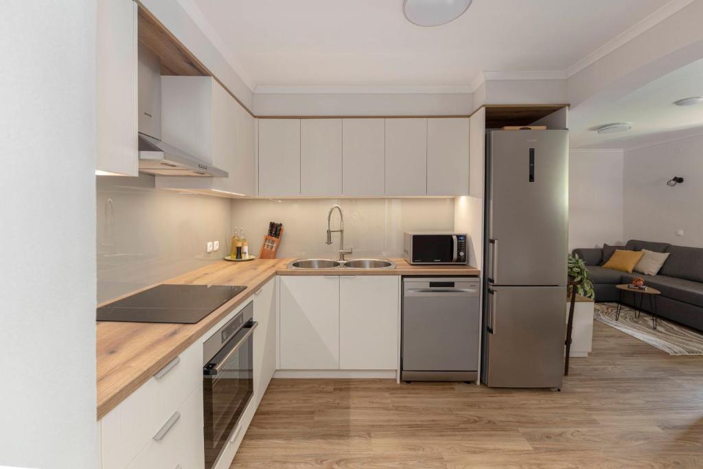 Kuchyň nebo kuchyňský kout v ubytování Apartments Ribnica