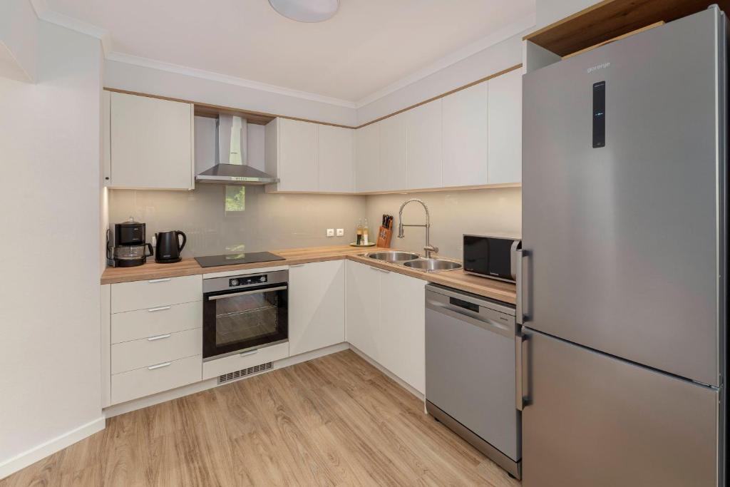Kuchyň nebo kuchyňský kout v ubytování Apartments Ribnica