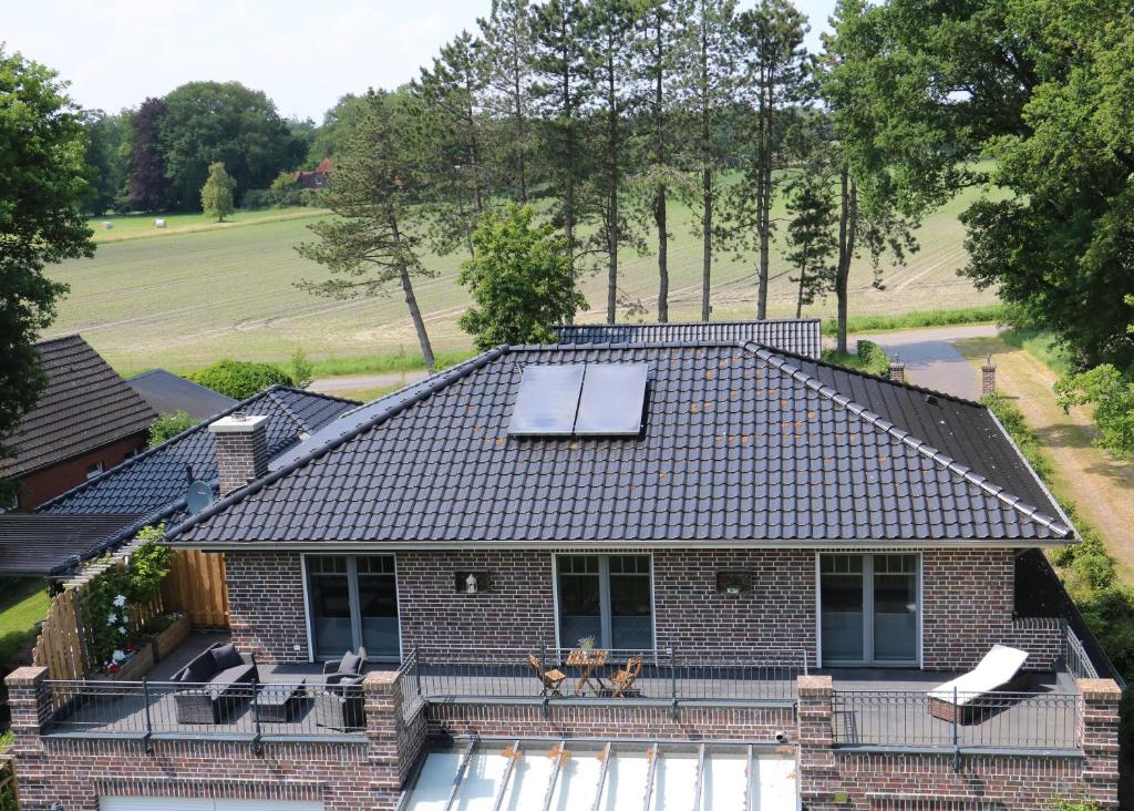 an overhead view of a house with a solar panel on the roof at Ferienwohnung Am Schippstroth in Wiefelstede