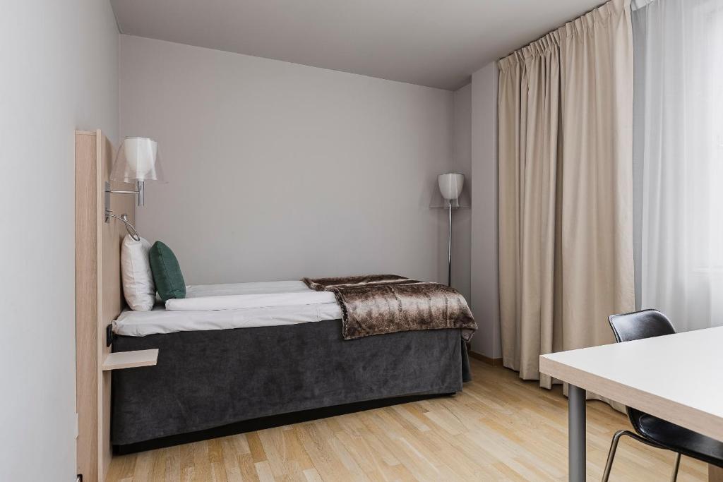 Postel nebo postele na pokoji v ubytování Quality Hotel Sundsvall