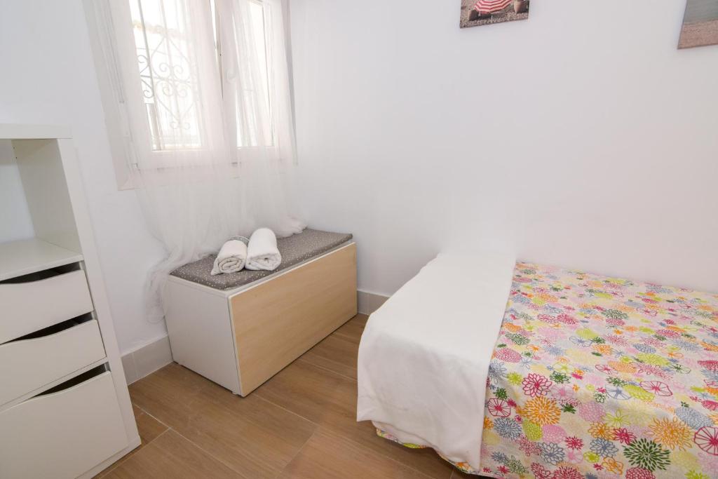 Postel nebo postele na pokoji v ubytování Apartamentos Atlantida