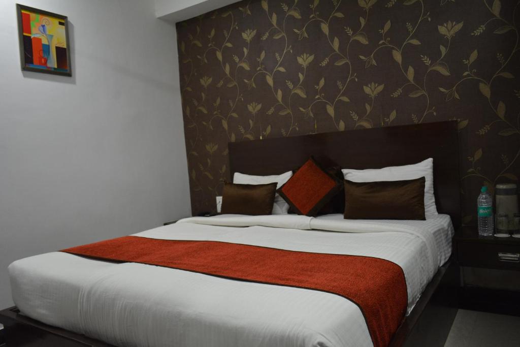 Postel nebo postele na pokoji v ubytování Hotel Samovar by Goyal Hotel