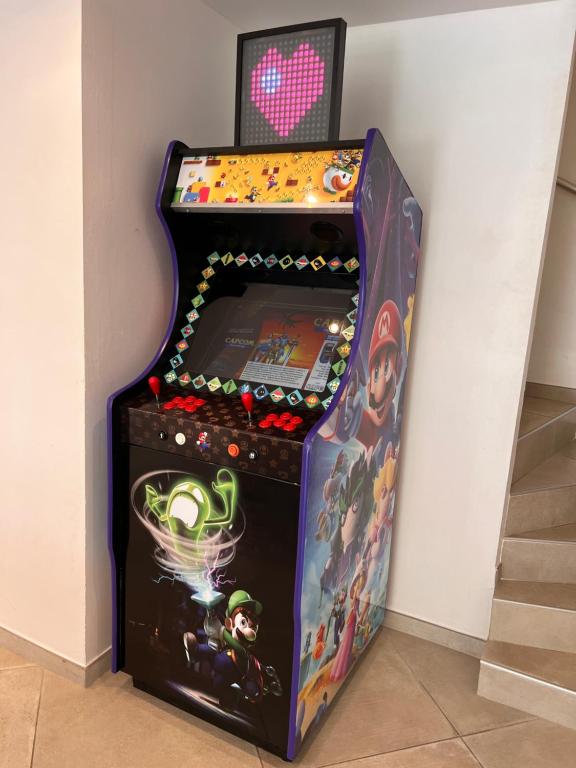 a video game machine with a heart on the screen at Grande Villa à Sainte Maxime - Golfe de Saint Tropez in Sainte-Maxime