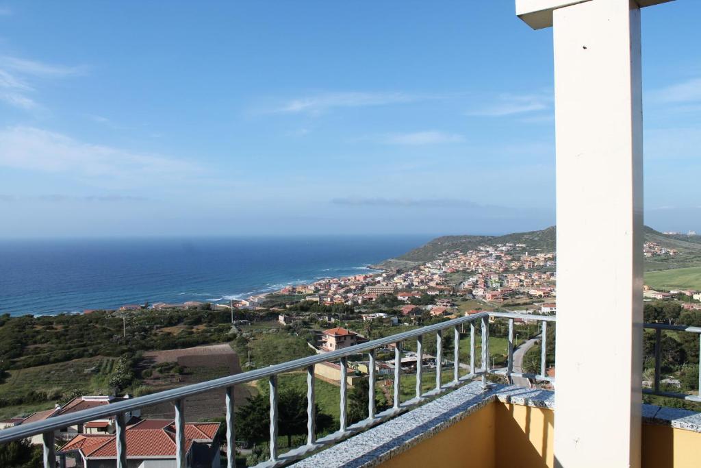 a view of the ocean from a balcony at B&B L'alba Nel Golfo in Castelsardo
