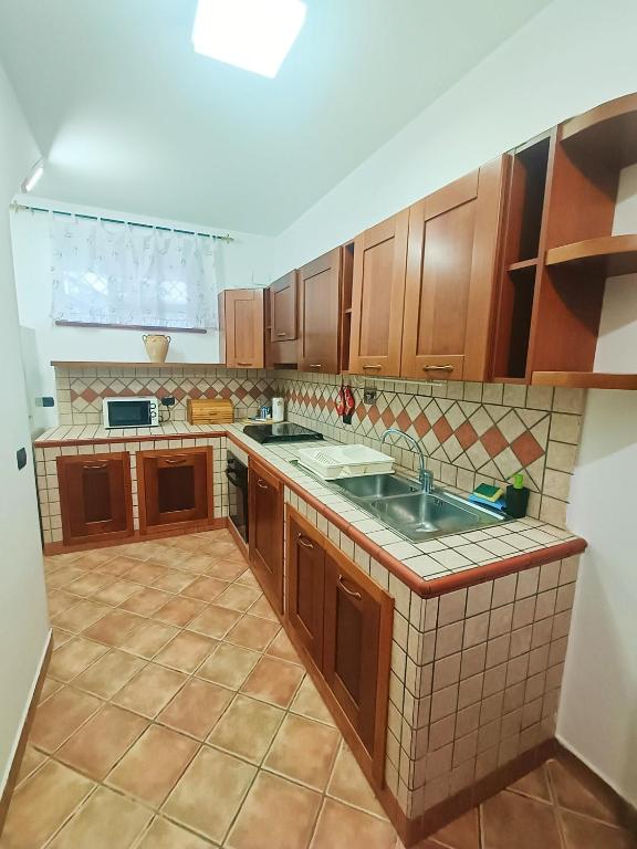 Kuchyň nebo kuchyňský kout v ubytování Salento Apartment