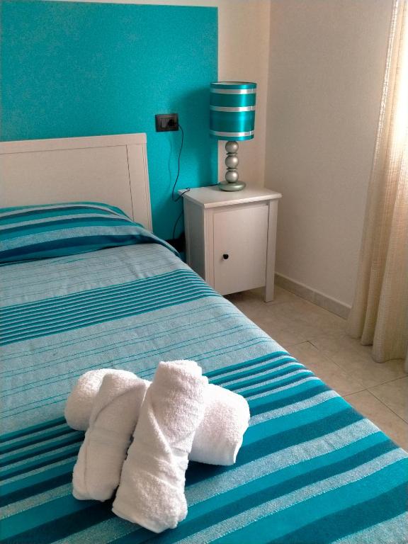 Postel nebo postele na pokoji v ubytování Mare e Sabbia