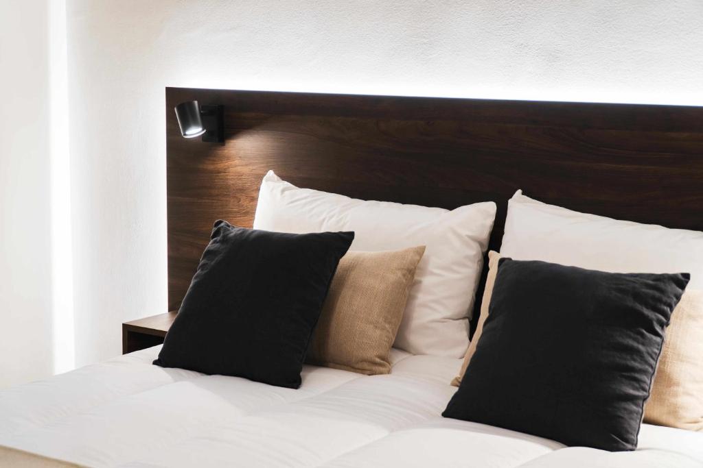Postel nebo postele na pokoji v ubytování Nido Baeza Suites
