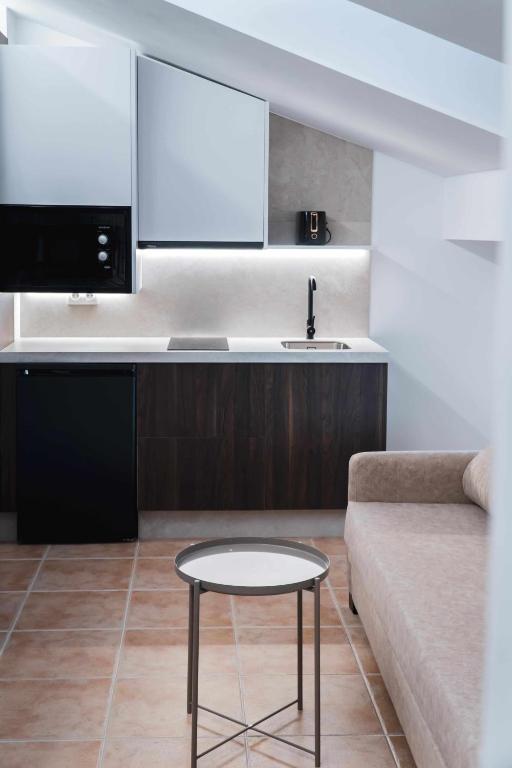 Kuchyň nebo kuchyňský kout v ubytování Nido Baeza Suites