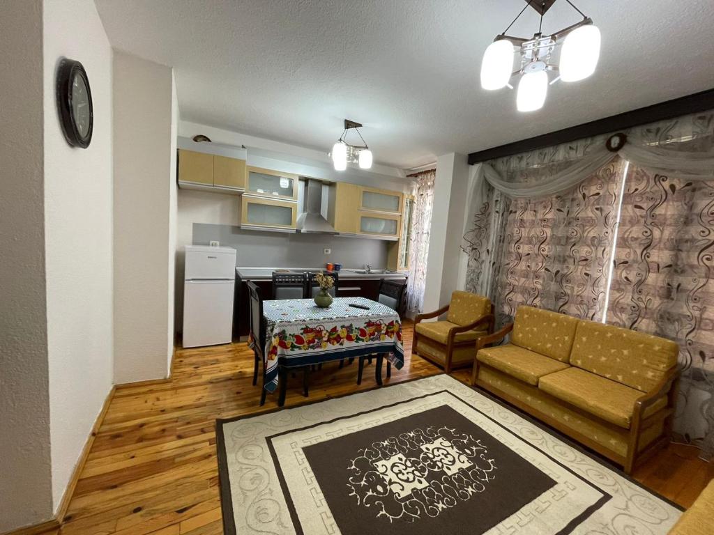 a living room with a couch and a table at Leones Villa in Pogradec