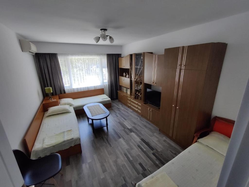 a small living room with a couch and a table at Apartment Serkyovi in Pomorie