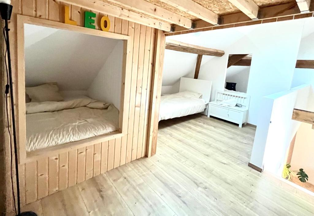 Postel nebo postele na pokoji v ubytování L'escale