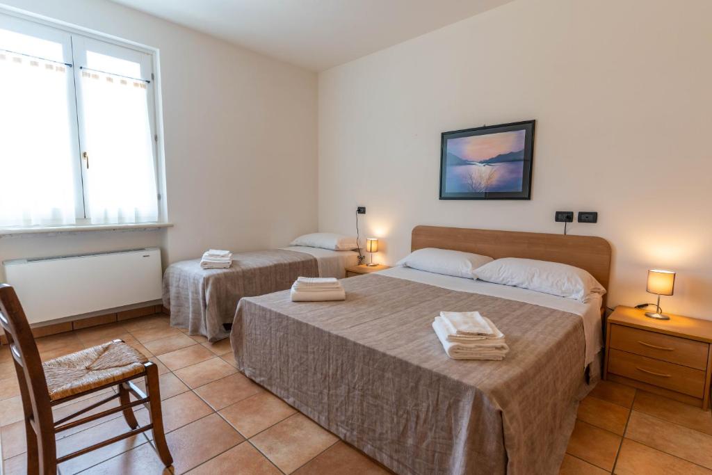 Postel nebo postele na pokoji v ubytování Agriturismo Corte Salandini