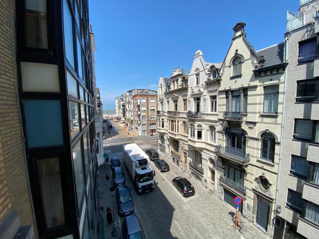 a view from a window of a city street with cars at Villa Stella Maris in Ostend