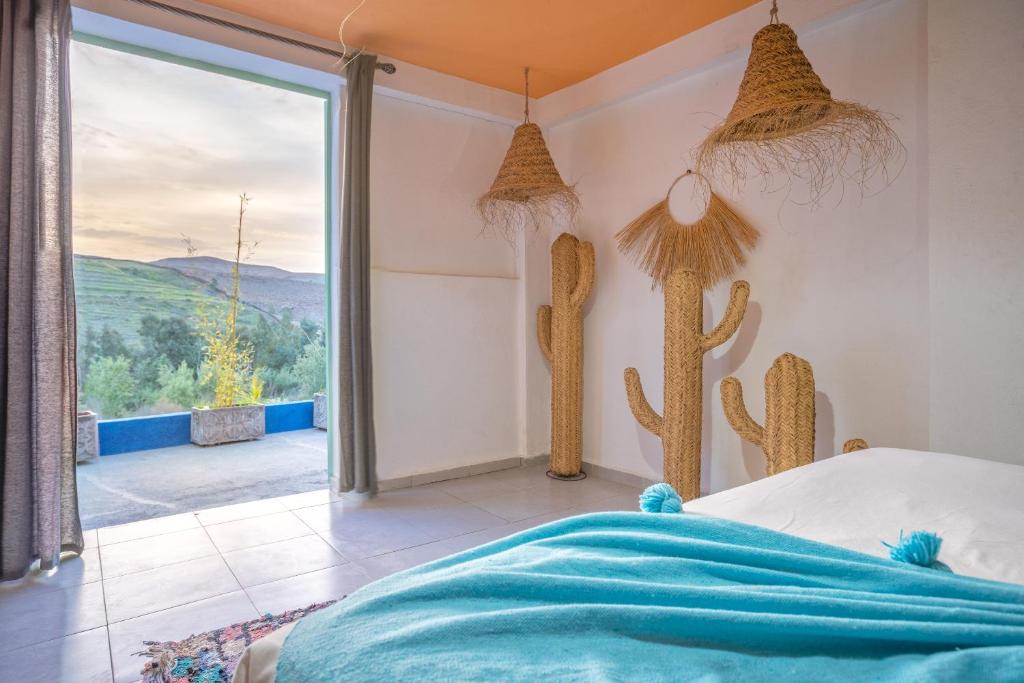 Postel nebo postele na pokoji v ubytování La Fattoria Ecolodge