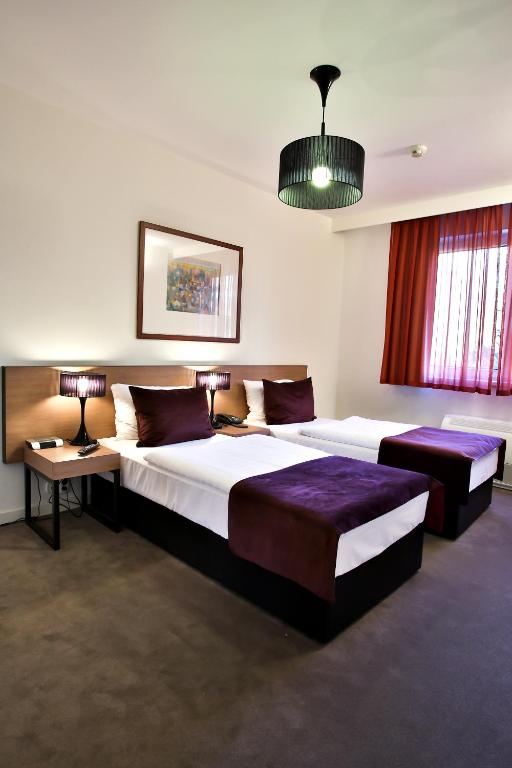 Postel nebo postele na pokoji v ubytování Adina Apartment Hotel Budapest