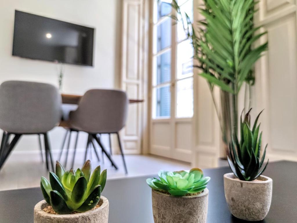 Televízia a/alebo spoločenská miestnosť v ubytovaní EDIFICIO DUQUE