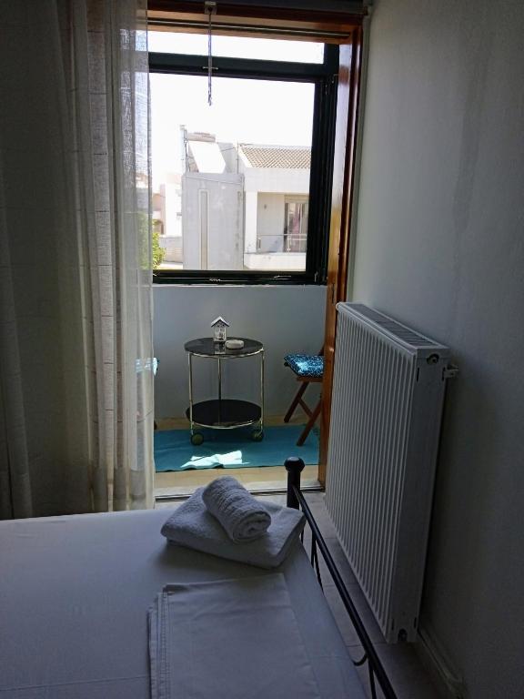 Posteľ alebo postele v izbe v ubytovaní ΑLEXANDRAS HOUSE
