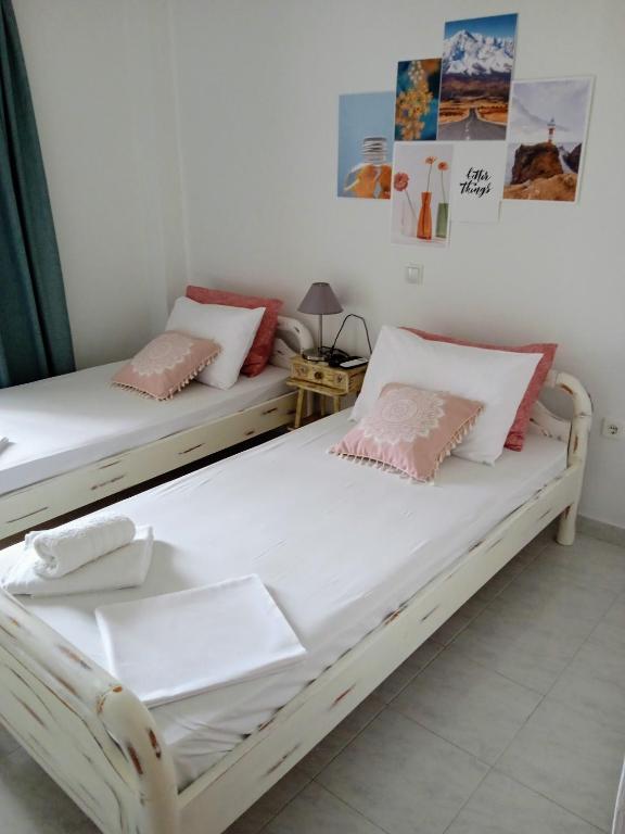 Posteľ alebo postele v izbe v ubytovaní ΑLEXANDRAS HOUSE