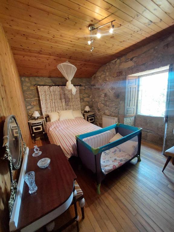 Posteľ alebo postele v izbe v ubytovaní A Casiña Casitas con jardin de ensueño
