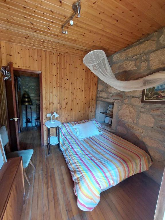 Posteľ alebo postele v izbe v ubytovaní A Casiña Casitas con jardin de ensueño
