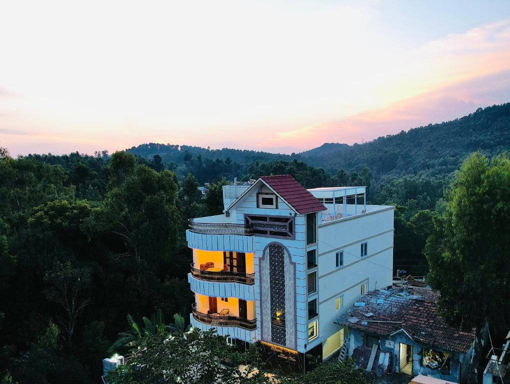 an aerial view of a building in the forest at Forest View Resort in Yercaud