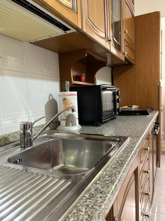 A kitchen or kitchenette at La Minicasa