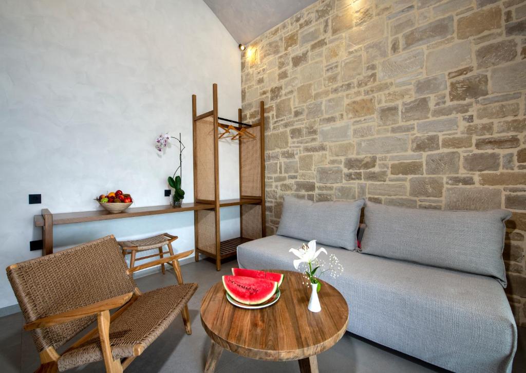 a living room with a couch and a table at Balos Beach in Kissamos