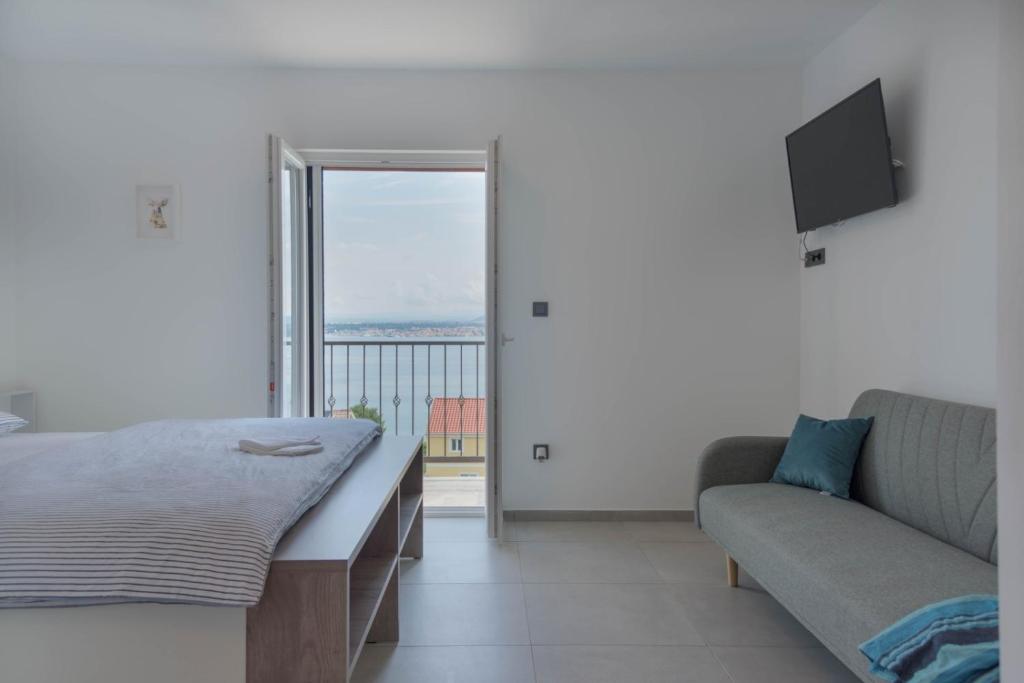 Postel nebo postele na pokoji v ubytování Kuća za odmor "Plaža"