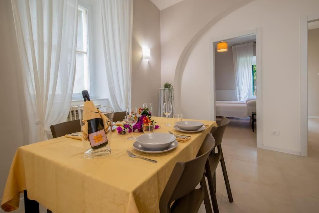 a dining room with a table with a yellow table cloth at CasaSmeraldo in Rio Marina