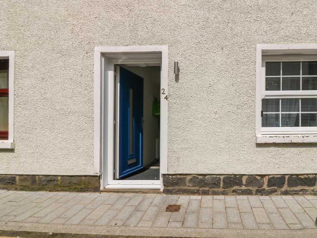 a door to a building with a blue door at 24 Bridge Street in Banff