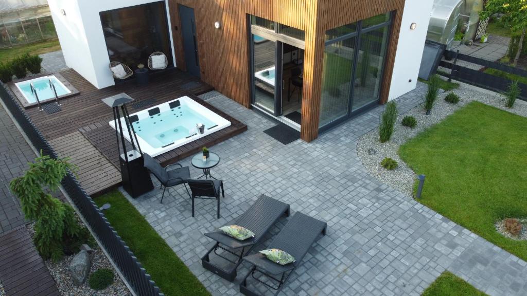 an aerial view of a patio with a hot tub at Lazy House Klaipeda in Klaipėda