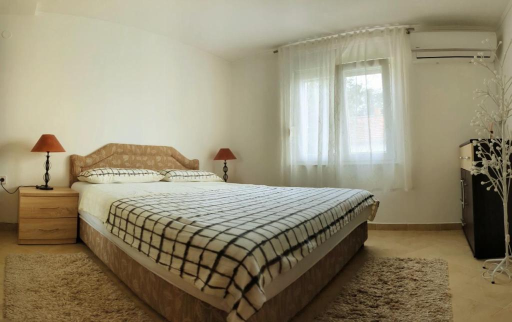 Postel nebo postele na pokoji v ubytování Apartman Dabecic