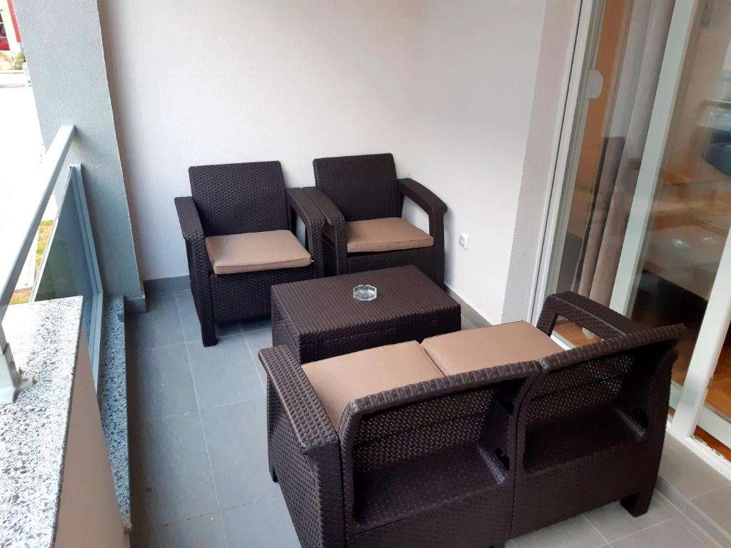 a group of chairs and a table on a balcony at Apartment Dream in Trebinje