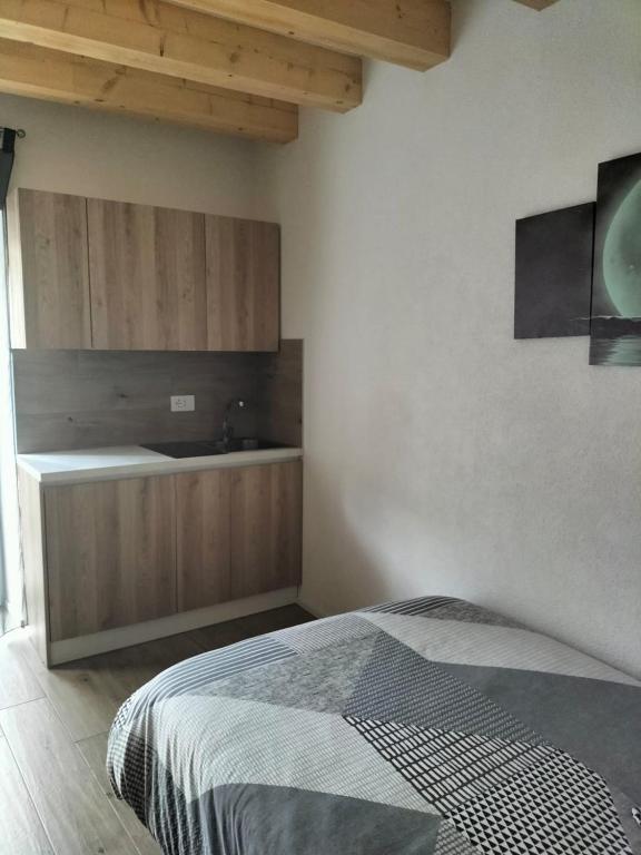 Postel nebo postele na pokoji v ubytování B&B Al Portico