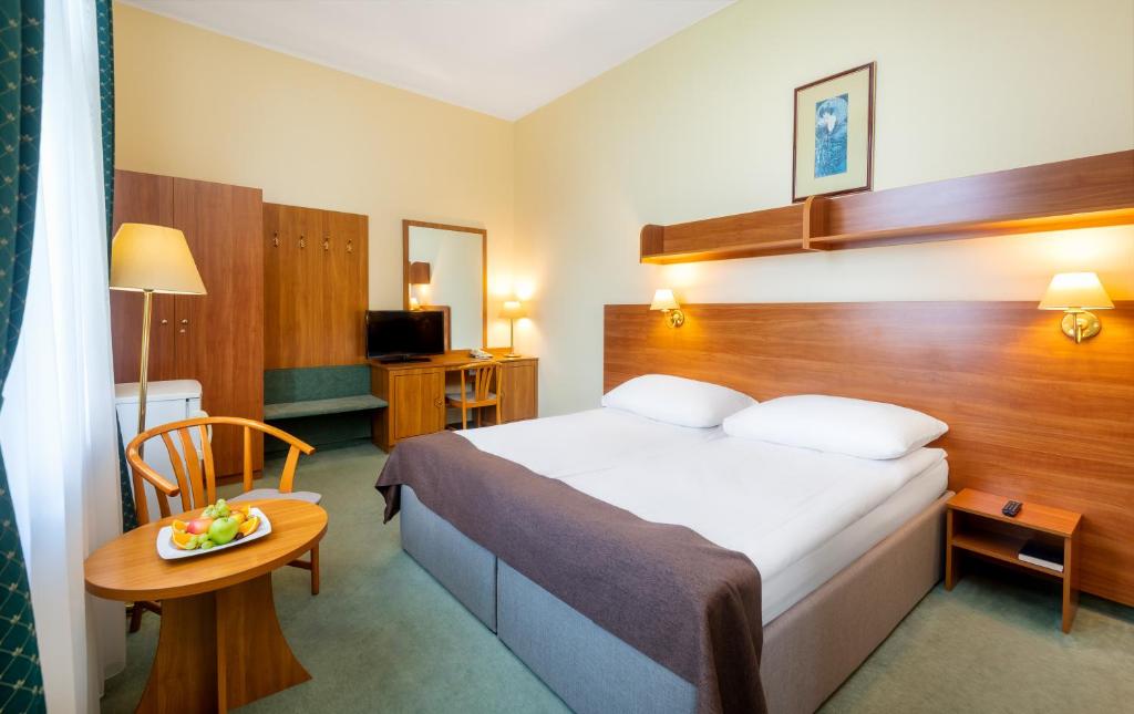 Posteľ alebo postele v izbe v ubytovaní Hotel Millennium