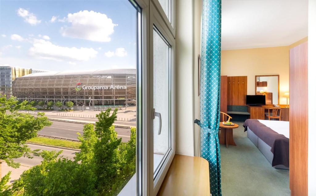 Posteľ alebo postele v izbe v ubytovaní Hotel Millennium