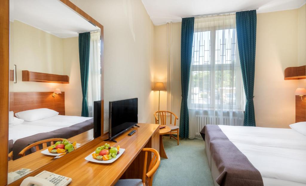 Posteľ alebo postele v izbe v ubytovaní Hotel Millennium