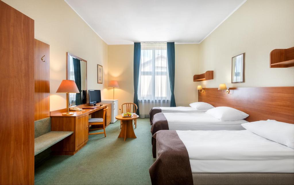 Posteľ alebo postele v izbe v ubytovaní Hotel Millennium