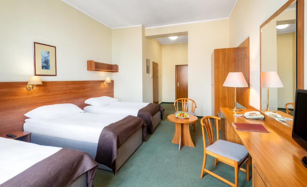 Posteľ alebo postele v izbe v ubytovaní Hotel Millennium