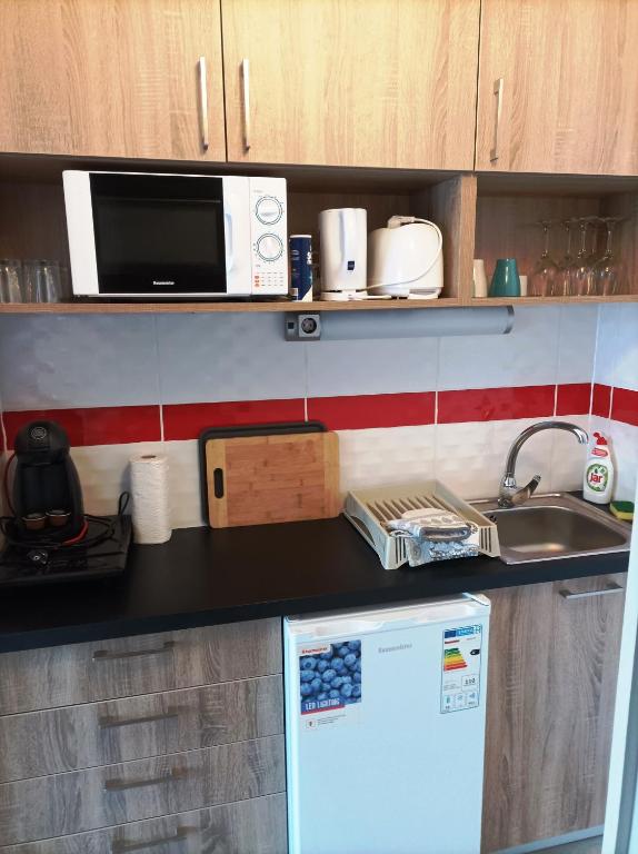 Kuchyň nebo kuchyňský kout v ubytování Sunrise Apartman
