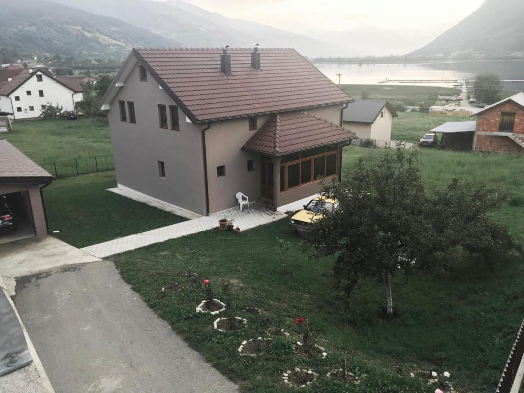 a house with a view of a yard at Mariner House in Plav