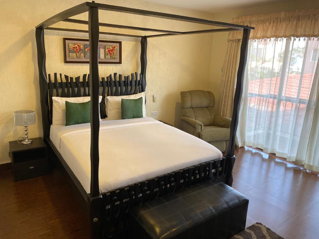 Postel nebo postele na pokoji v ubytování Progressive Park Hotel
