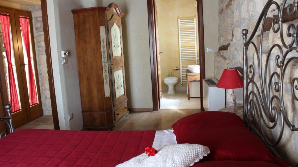 Posteľ alebo postele v izbe v ubytovaní B&B Lo Gnomo