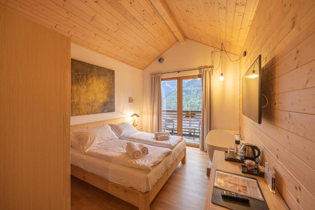 Postel nebo postele na pokoji v ubytování Giallo Dolomiti Wellness