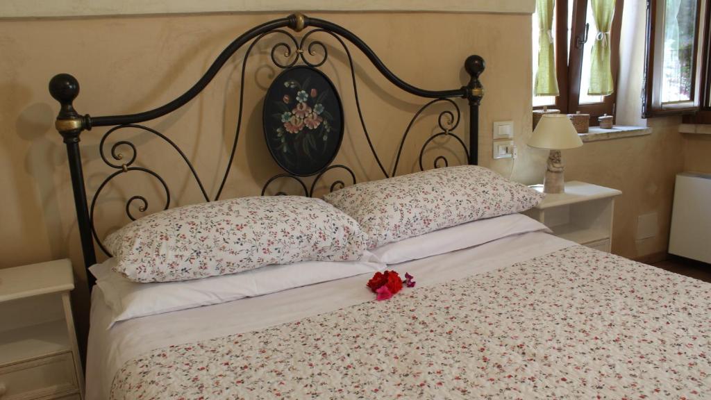 Posteľ alebo postele v izbe v ubytovaní B&B Lo Gnomo