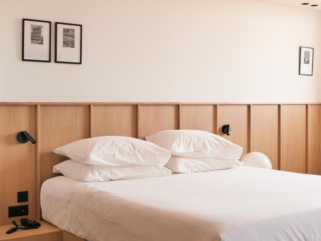 Postel nebo postele na pokoji v ubytování Hotel Moderne
