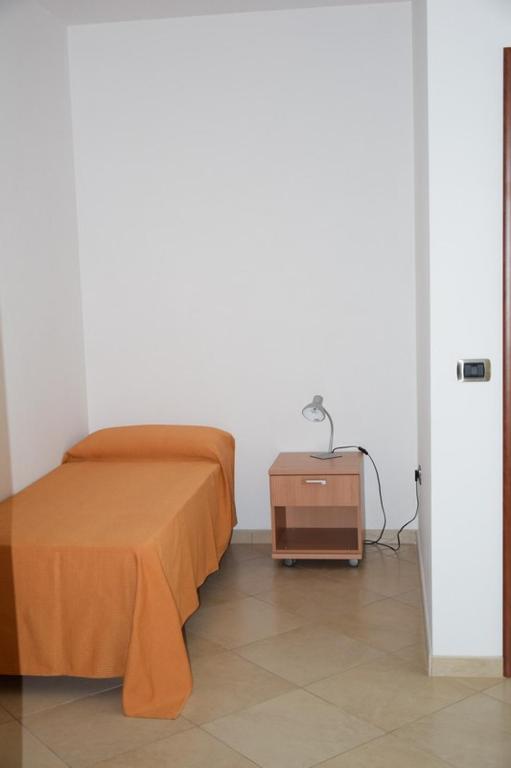 Postel nebo postele na pokoji v ubytování Hotel Maggiore